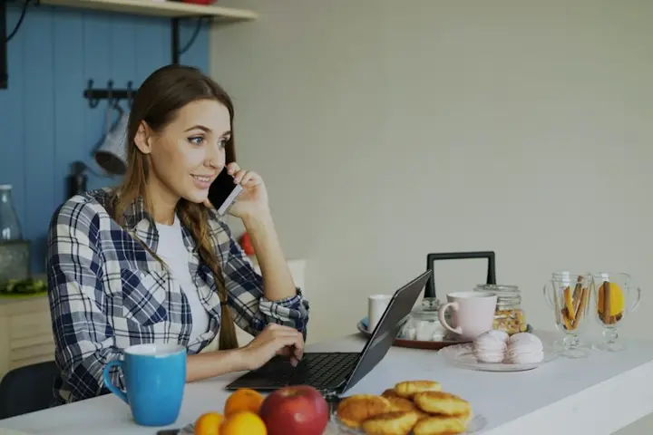 Woman filling in an online form on her laptop